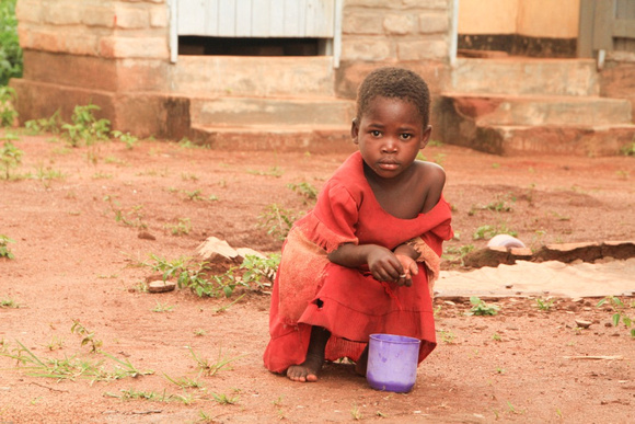 Girl in red harvesting termites Malawi