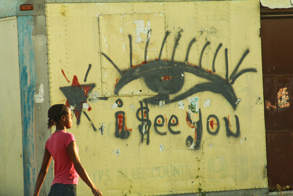 Girl in front of eye grafiti
