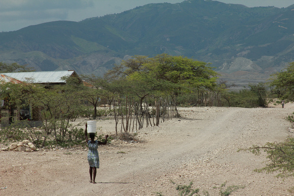 Woman on long road Haiti