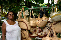 Woman with woven baskets for sale Port Salut Haiti